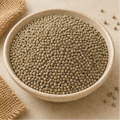 Grey-green bajra grains in a ceramic bowl